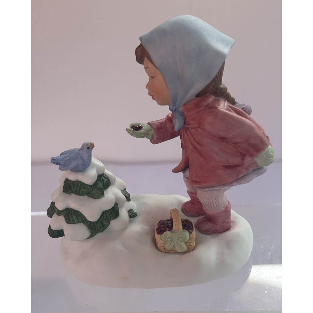 1986  Avon "We Wish You a Merry Christmas" Girl Feeding Bird Musical Figurine